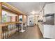 Updated kitchen featuring white cabinets, stainless steel appliances, and an eat-in bar at 100 Dudley St, Lakewood, CO 80226