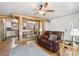 Open-concept living room with hardwood floors and an opening into an adjacent kitchen area at 100 Dudley St, Lakewood, CO 80226
