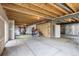 Large unfinished basement with exposed beams, gym area, and ready to be finished at 22527 E Layton Cir, Aurora, CO 80015