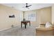 Spacious bonus room featuring a foosball table, neutral walls, plush carpeting, and windows with plantation shutters at 22527 E Layton Cir, Aurora, CO 80015