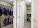 Dual walk-in closets with custom shelving and rods for optimal storage and organization of clothes at 22527 E Layton Cir, Aurora, CO 80015