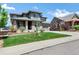 Stunning two-story home with a well manicured lawn and a large two-car attached garage at 22527 E Layton Cir, Aurora, CO 80015