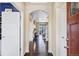 Elegant foyer with gleaming wood floors, an arched entryway, and a view of the light-filled rooms at 22527 E Layton Cir, Aurora, CO 80015