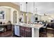 Open-concept space featuring kitchen, dining, and living areas with modern finishes and ample natural light at 22527 E Layton Cir, Aurora, CO 80015