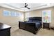 This primary bedroom is spacious and features recessed lighting, large windows, and neutral walls at 22527 E Layton Cir, Aurora, CO 80015