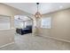 The primary bedroom connects to a bathroom and features large windows that bring in natural light at 22527 E Layton Cir, Aurora, CO 80015