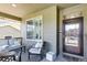 Cozy front porch features comfortable seating, neutral finishes, and a welcoming entrance at 22527 E Layton Cir, Aurora, CO 80015