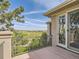 Private balcony features wood flooring, metal railings and views of the community golf course at 5149 Raintree Dr, Parker, CO 80134