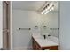 Bathroom featuring a white marble countertop, dark wood cabinets, and a modern vanity light at 5149 Raintree Dr, Parker, CO 80134