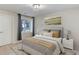 Cozy bedroom featuring a Queen bed with decorative pillows, a serene painting, and natural light at 5149 Raintree Dr, Parker, CO 80134