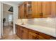 Butler's pantry featuring wood cabinets, subway tile backsplash and large counterspace at 5149 Raintree Dr, Parker, CO 80134