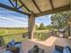 Relax on this deck overlooking green spaces with a built in grill and outdoor seating area at 5149 Raintree Dr, Parker, CO 80134
