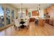 Open kitchen and dining area with hardwood floors, modern lighting and stainless appliances at 5149 Raintree Dr, Parker, CO 80134