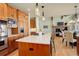 Stylish kitchen with a large island, stainless steel appliances, and an open view into the living area at 5149 Raintree Dr, Parker, CO 80134
