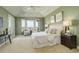 Bright main bedroom boasting large windows with beautiful views, sitting area, and neutral tones at 5149 Raintree Dr, Parker, CO 80134