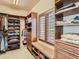 Walk-in closet with adjustable shelving and storage bench at 5149 Raintree Dr, Parker, CO 80134