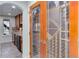 View of a wine cellar featuring a decorative etched-glass door and wooden wine racks at 5149 Raintree Dr, Parker, CO 80134