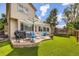 Well-maintained backyard featuring an inviting patio set, grill, and trampoline at 5133 E Essex Ave, Castle Rock, CO 80104