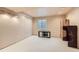 Unfinished basement area with a window and carpeted floor at 5133 E Essex Ave, Castle Rock, CO 80104