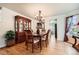 Elegant dining room featuring hardwood floors, stylish furnishings, and a view into the kitchen at 5133 E Essex Ave, Castle Rock, CO 80104