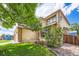Charming two-story home featuring brick and siding accents, lush landscaping, and a welcoming front porch at 5133 E Essex Ave, Castle Rock, CO 80104