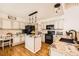 Well-equipped kitchen featuring granite countertops, modern appliances, and ample cabinet space at 5133 E Essex Ave, Castle Rock, CO 80104