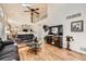 Inviting living room featuring a vaulted ceiling, an open layout, and a view of the kitchen at 5133 E Essex Ave, Castle Rock, CO 80104