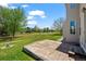 This home has a large grassy yard, a stone patio, and a wood fence around the perimeter at 708 Teal Cir, Longmont, CO 80503