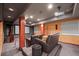 Finished basement with an entertainment system, large speakers and comfortable seating at 708 Teal Cir, Longmont, CO 80503