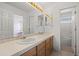 Bathroom features a double sink, light countertops and a view of the shower and toilet at 708 Teal Cir, Longmont, CO 80503