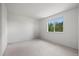 A bright bedroom that features carpet and a window with lots of natural light at 708 Teal Cir, Longmont, CO 80503