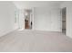 Bedroom featuring carpet, bright light and multiple doors at 708 Teal Cir, Longmont, CO 80503