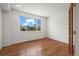 Bedroom featuring a large window providing a view to the outside at 708 Teal Cir, Longmont, CO 80503