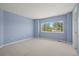 Bedroom with blue walls and a window offering lots of natural light at 708 Teal Cir, Longmont, CO 80503
