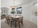 Elegant dining room featuring a modern table with seating for six, and a stylish light fixture at 708 Teal Cir, Longmont, CO 80503
