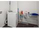Laundry room with a new washer and dryer and shelves at 708 Teal Cir, Longmont, CO 80503