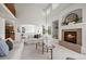 Bright living room featuring a fireplace, soaring ceilings, and an abundance of natural light at 708 Teal Cir, Longmont, CO 80503
