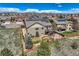 A beautiful, well-maintained backyard with a wooden fence, landscaping, grass, and a deck perfect for outdoor entertaining at 6216 E 135Th Ave, Thornton, CO 80602