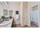 Bright bathroom with a shower-tub combo and a neutral color palette at 6216 E 135Th Ave, Thornton, CO 80602