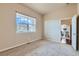 A bedroom has an abundance of natural light from a large window at 6216 E 135Th Ave, Thornton, CO 80602