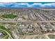 Panoramic aerial view of a community with modern homes, green spaces, roads, and a picturesque environment at 6216 E 135Th Ave, Thornton, CO 80602