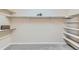 A neutral walk-in closet with custom built-in shelving at 6216 E 135Th Ave, Thornton, CO 80602