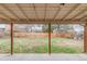 Expansive backyard with a covered patio and a fenced-in perimeter, perfect for outdoor activities at 117 S Pierce St, Lakewood, CO 80226
