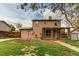 Expansive backyard featuring a charming patio and lush green lawn at 17882 E Wyoming Pl, Aurora, CO 80017