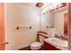 Small bathroom featuring a granite countertop, wood vanity, and standard toilet at 17882 E Wyoming Pl, Aurora, CO 80017