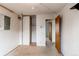 Cozy bedroom featuring neutral walls, carpet flooring, closet and adjoining doorway at 17882 E Wyoming Pl, Aurora, CO 80017