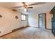 Carpeted bedroom featuring neutral walls, window, radiator, and ceiling fan at 17882 E Wyoming Pl, Aurora, CO 80017