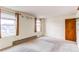 Spacious bedroom featuring natural light from two windows and an electric baseboard heater at 17882 E Wyoming Pl, Aurora, CO 80017