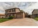 Home exterior featuring a concrete driveway, attached garage, and tidy landscaping at 17882 E Wyoming Pl, Aurora, CO 80017