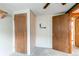 Functional hallway with carpet and multiple doors leading to other rooms at 17882 E Wyoming Pl, Aurora, CO 80017